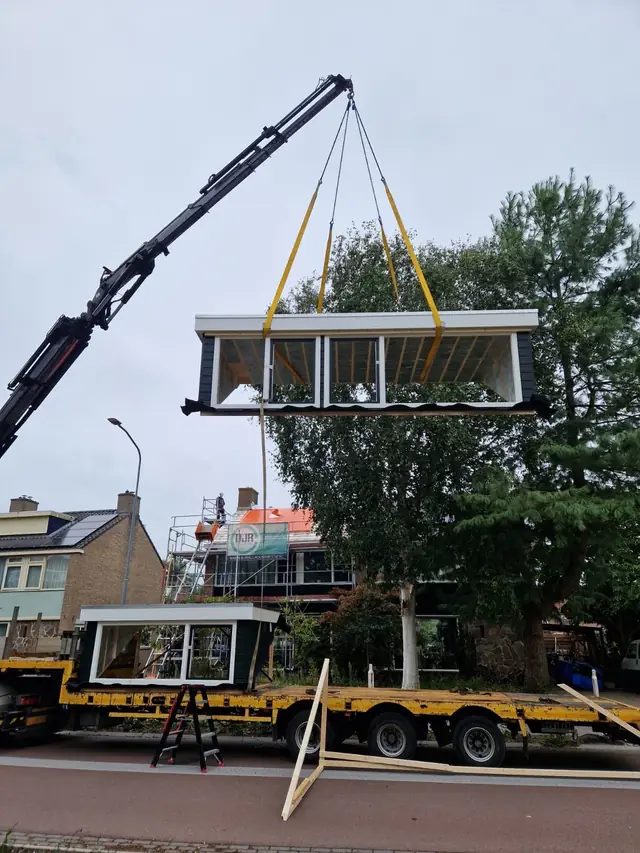 Prefab dakkapellen met groene gevelbekleding, foto 8 van 10